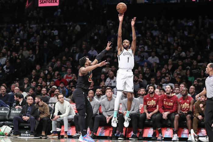 Brooklyn Nets forward Mikal Bridges (1) shoots a three-point basket over Cleveland Cavaliers guard Donovan Mitchell (45)